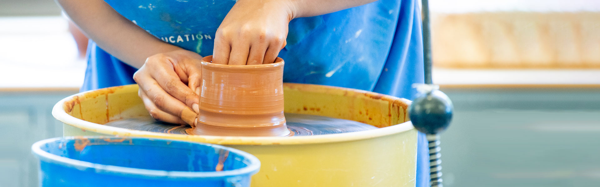Student making pottery