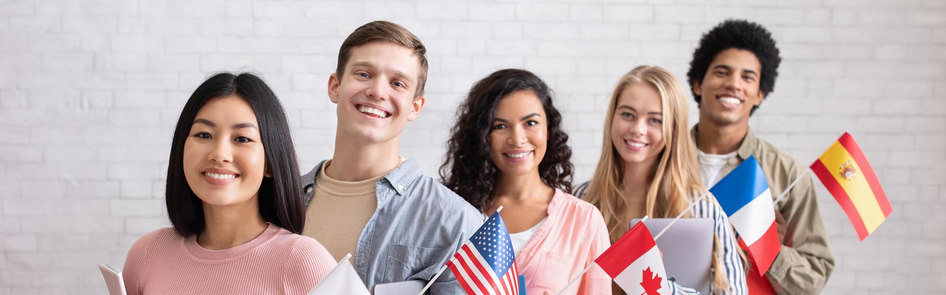 Students holding various country flags