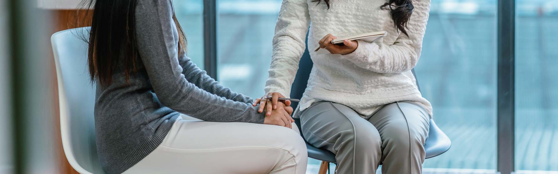Therapist talking to patient