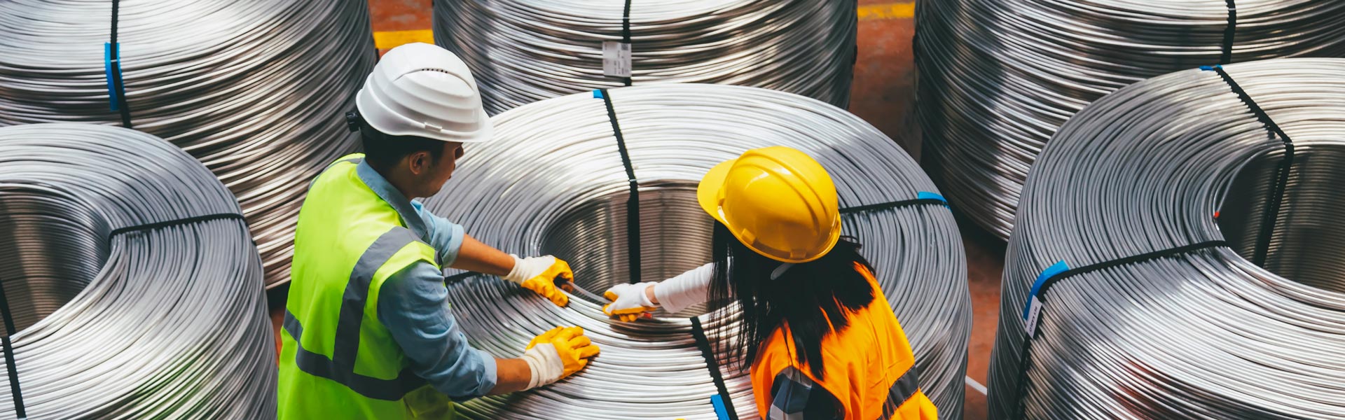 Materials engineers working on stacks of wires