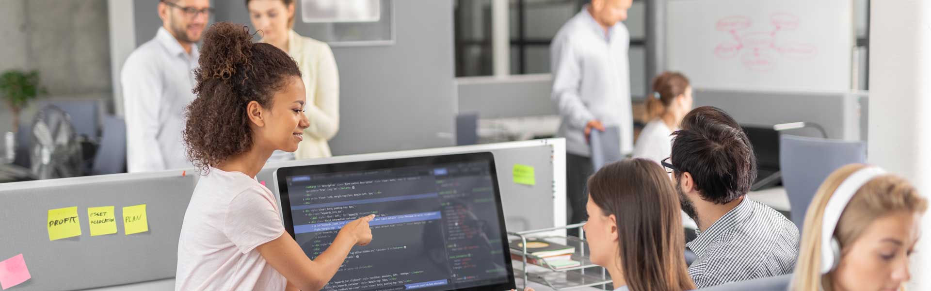 Man pointing at the computer monitor