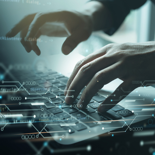 hand pointing at computer monitor