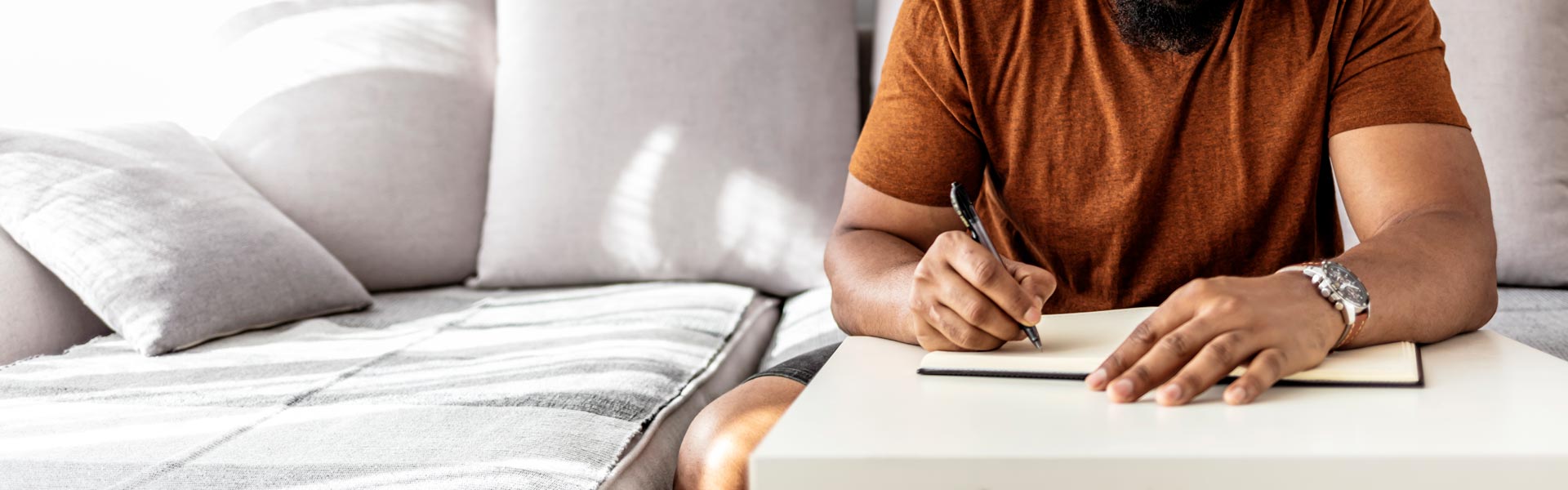 Person writing on a book