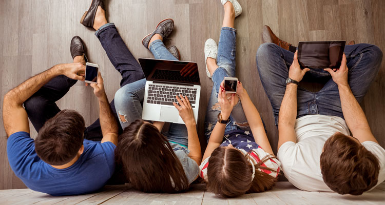 People using computers, tablets and phones